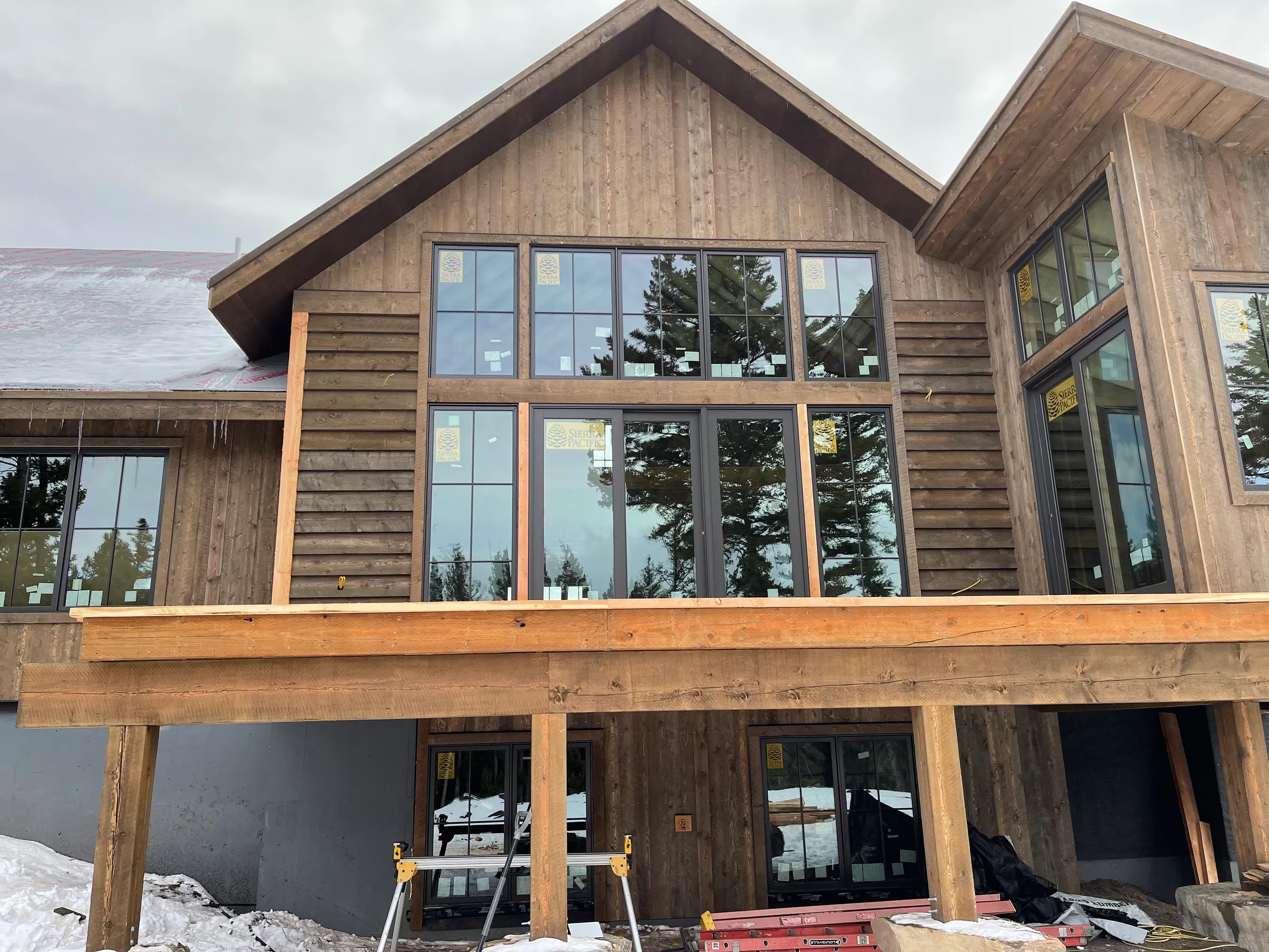 Mountain home with massive windows in winter